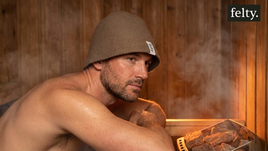 Man relaxing in a steam room wearing one of our durable sauna hats for daily male use.