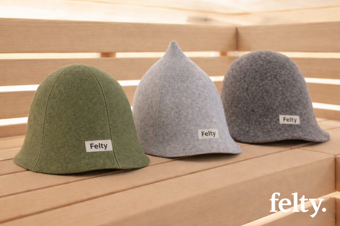 Three felt sauna hats on wooden bench, with Felty logo placed at bottom right corner.