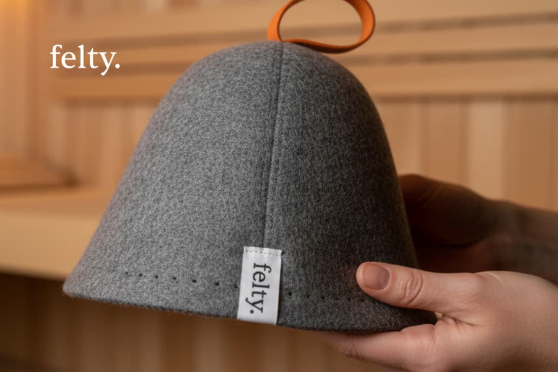 This image showcases a specialized sauna hat, highlighting the product's plush, felt-like material and thoughtful design to enhance comfort and relaxation during sauna sessions.