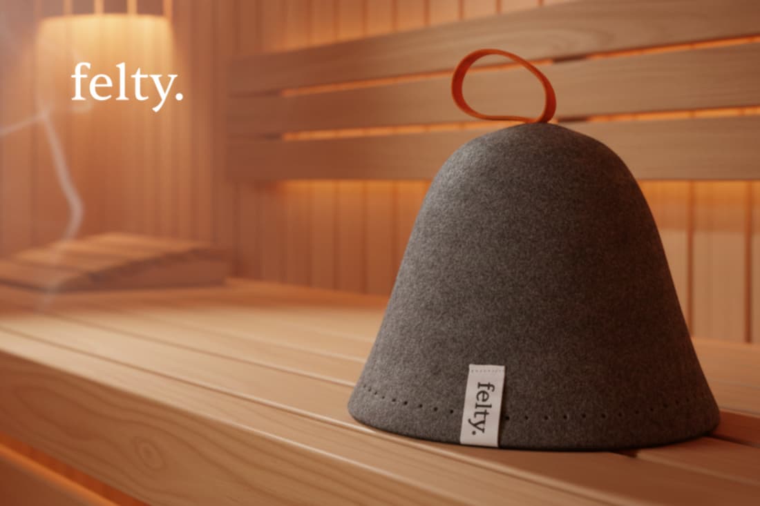 This image depicts a custom-made sauna hat, showcasing the plush, felt-like material and thoughtful design details that optimize comfort and relaxation in a sauna environment.